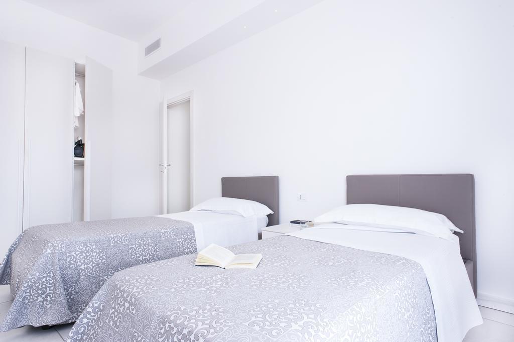 Vuelle Residence Apartments Capo dʼOrlando Quarto foto